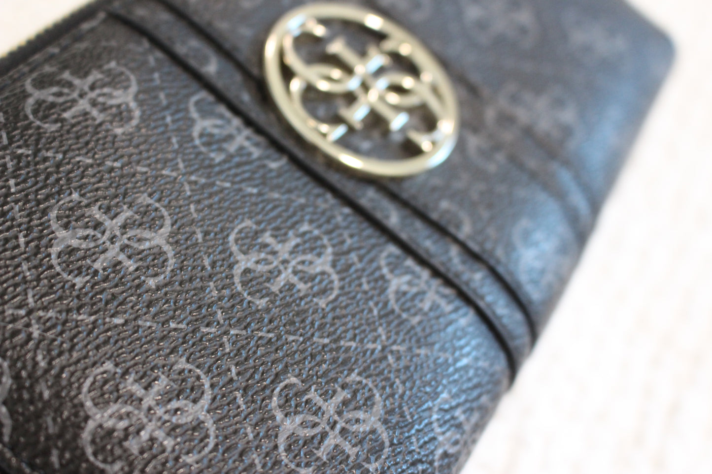 GUESS Black Wallet with Gold Emblem